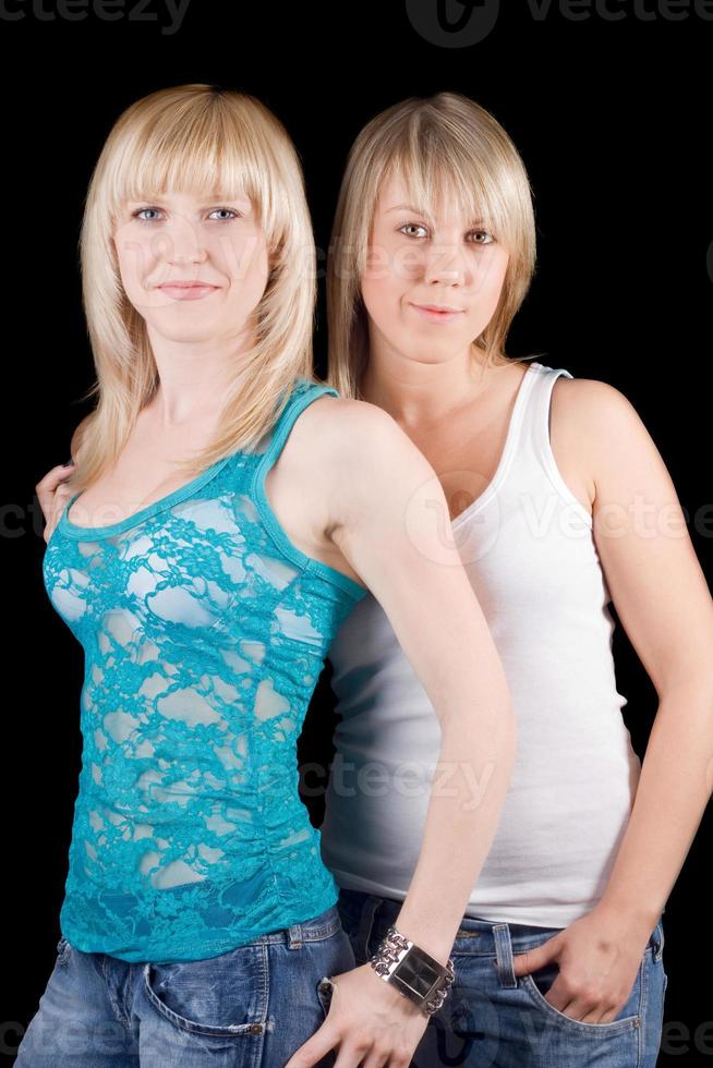 Portrait of the two young beauty blonde. Isolated photo