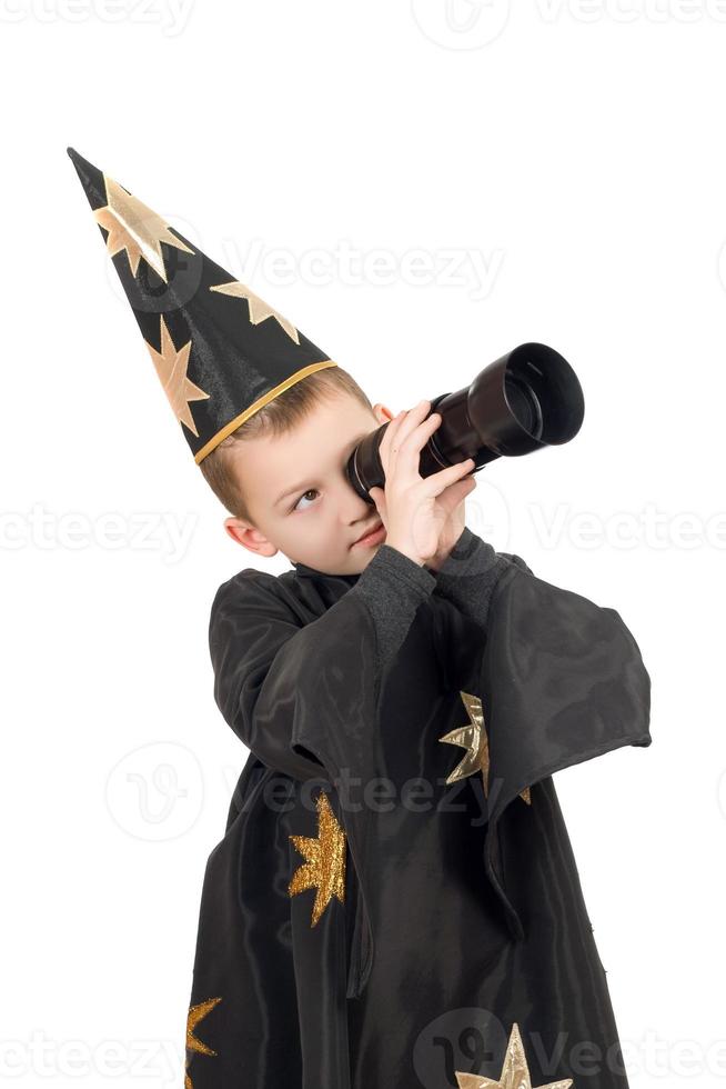 Boy dressed as astrologer. Isolated photo