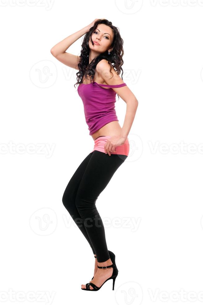 Seductive young brunette in a black leggings photo