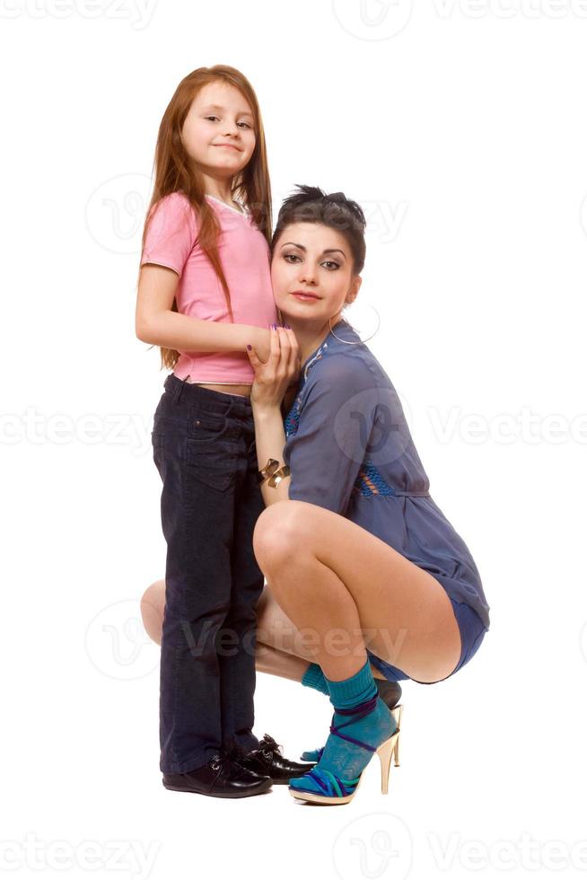 Happy young mother and little daughter. Isolated photo