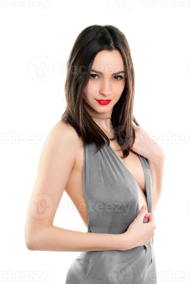 Brunette posing in grey dress photo