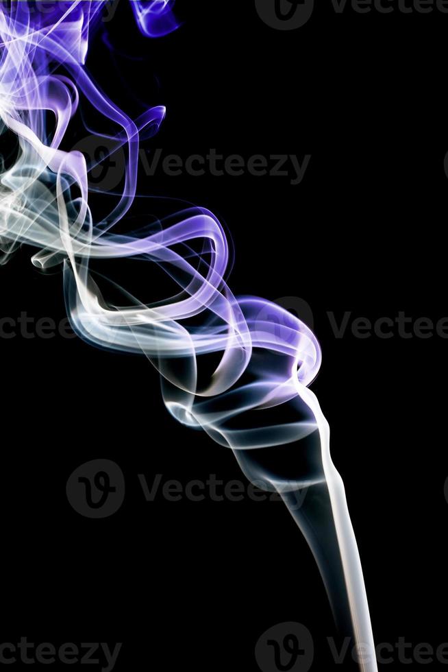 Abstract violet smoke. Isolated on a black background photo