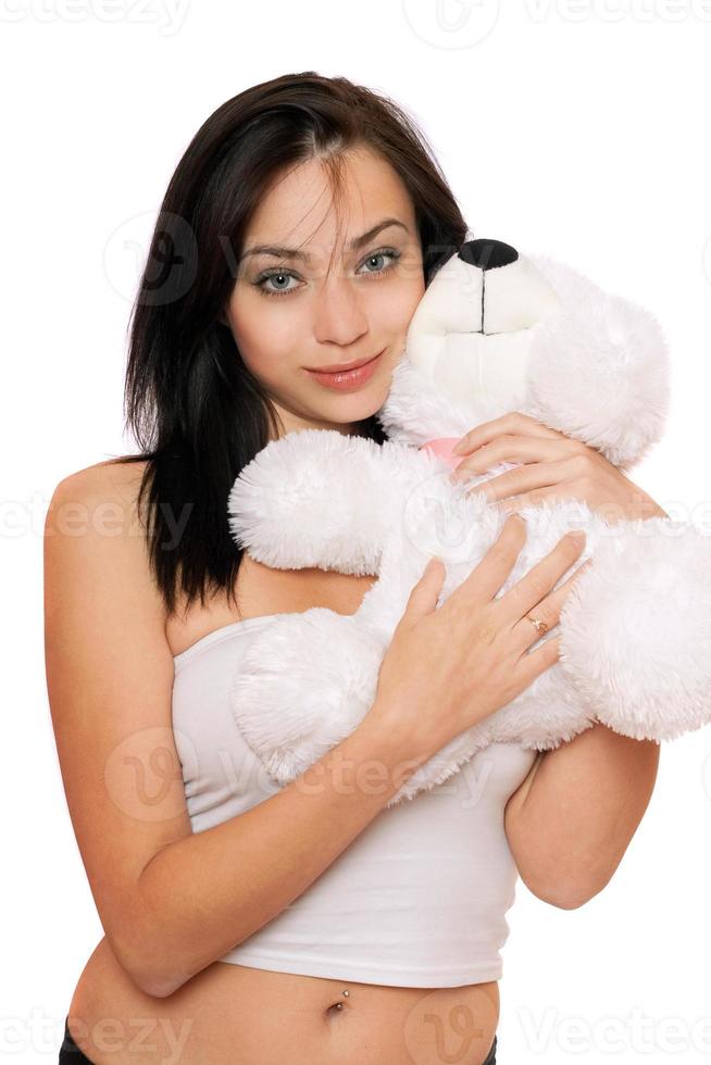 linda chica sonriente con un oso de peluche foto