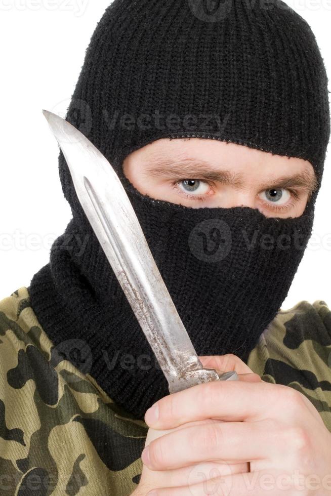 Portrait of the criminal in a black mask with a knife photo