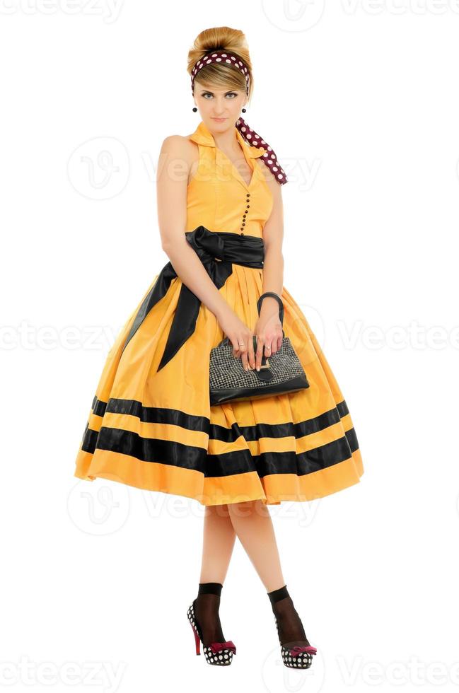 Cute young woman in yellow dress photo