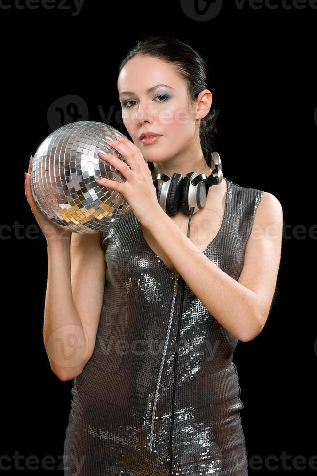 Portrait of young woman with a mirror ball photo
