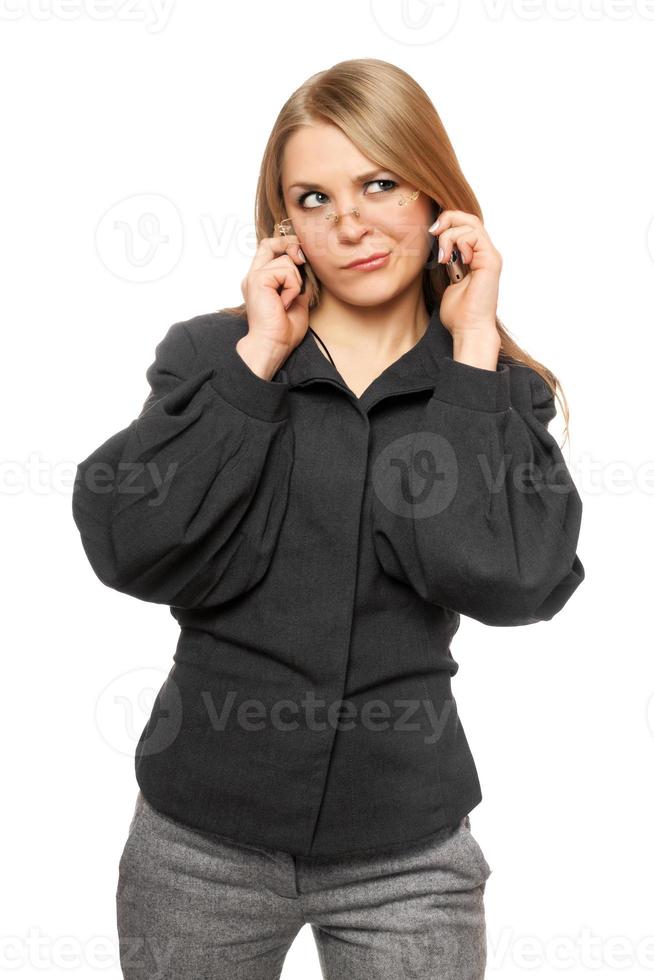 Discontented young blonde in a gray business suit photo