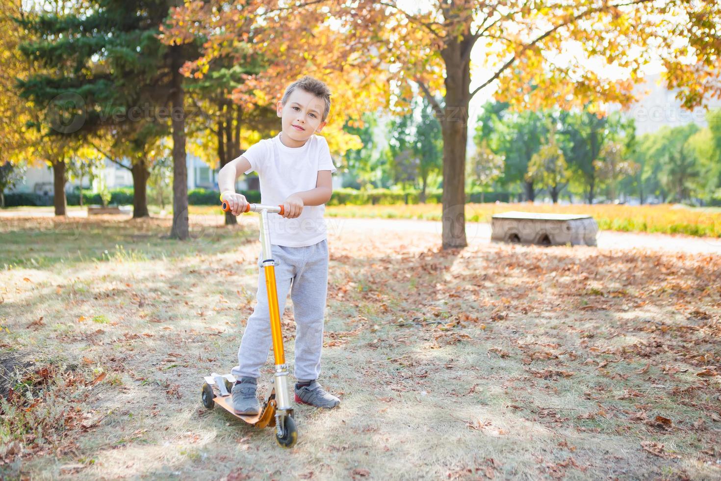 Little boy on scooter photo