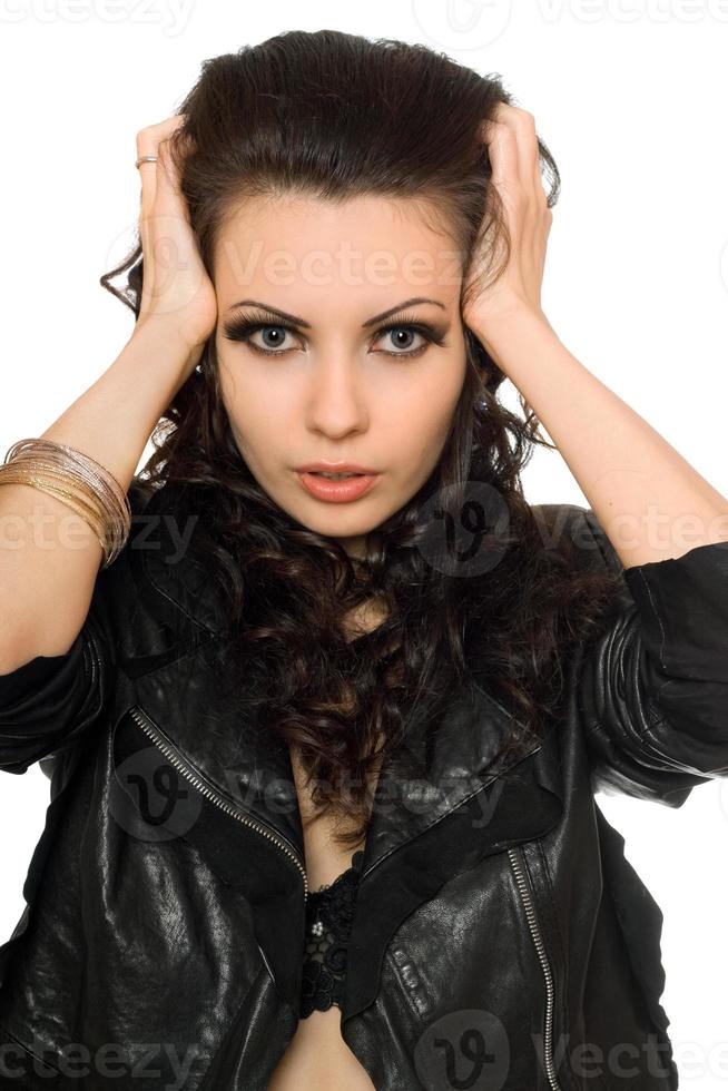 Closeup portrait of beautiful brunette in black clothes photo