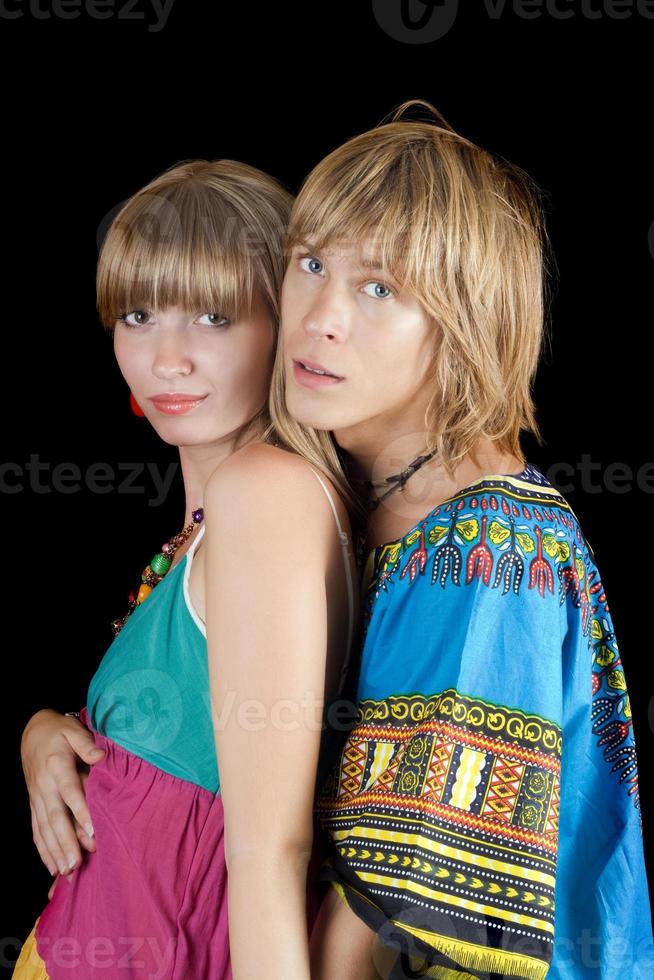 Portrait of the young beauty couple. Isolated on black background photo