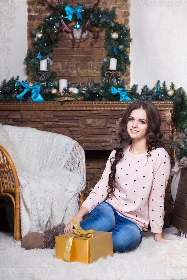 Pretty woman sitting on the carpet photo