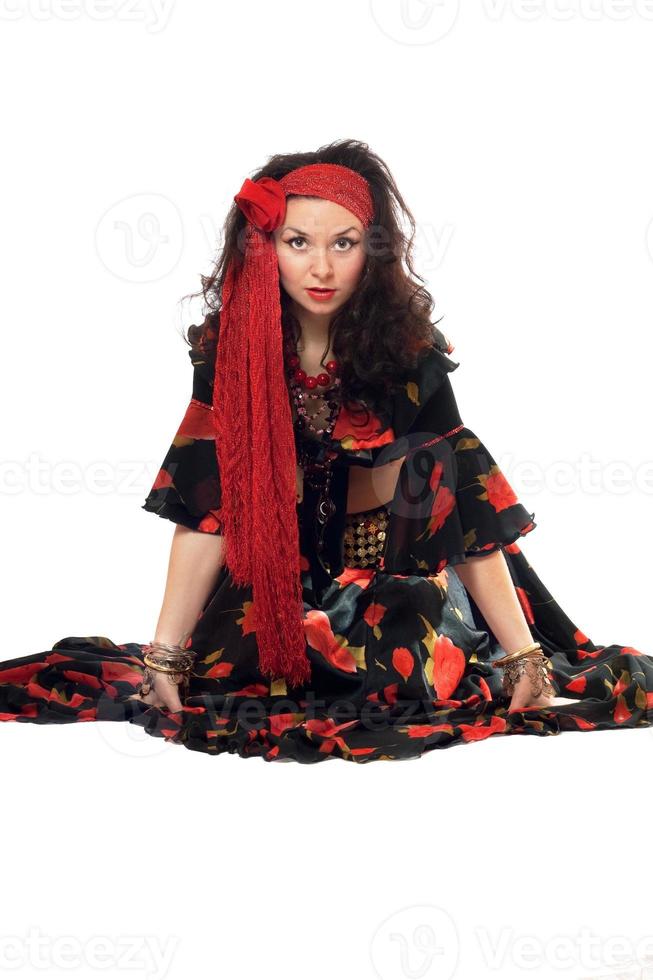 Sitting gypsy woman photo