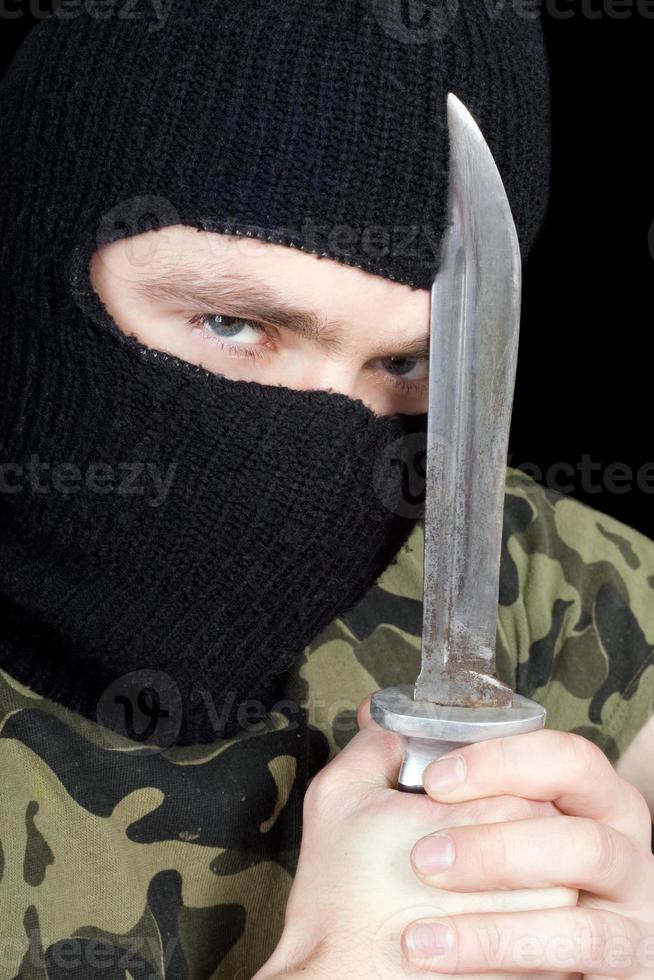 Portrait of  the criminal with a knife photo