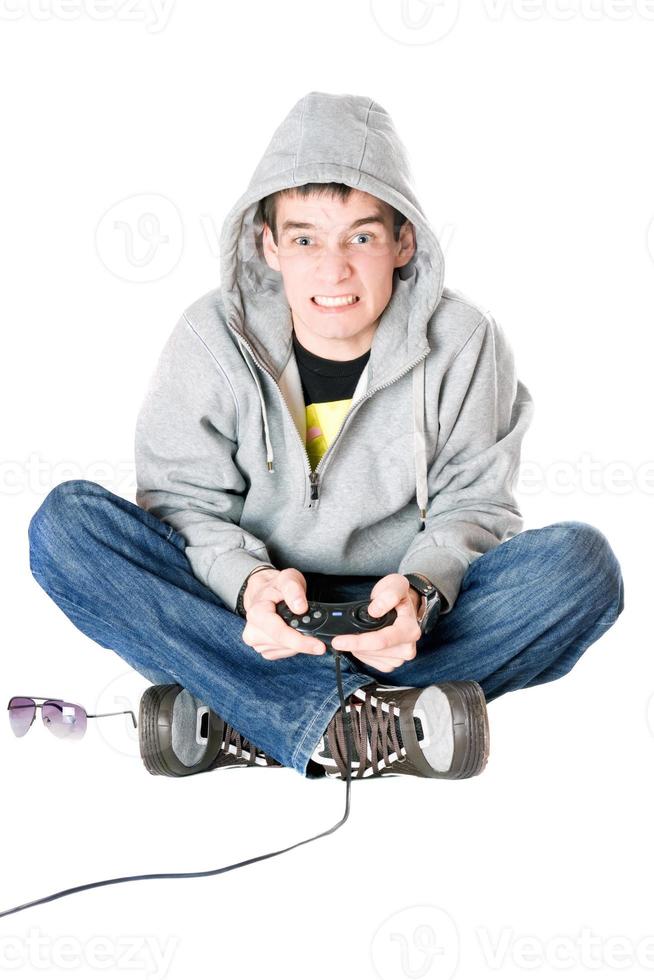 Young man in hood with a joystick photo