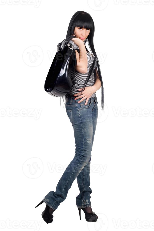linda chica con un bolso. aislado en blanco foto