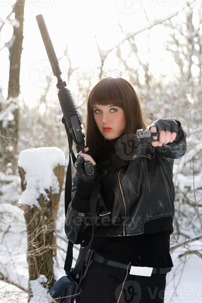 Portrait of armed nice young lady photo
