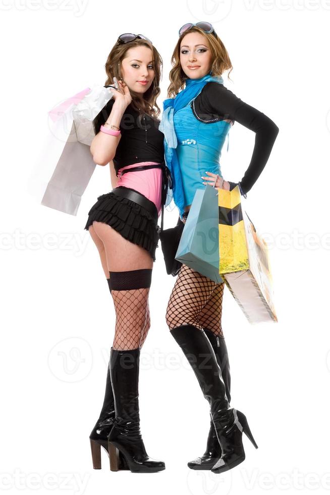 Two attractive young women after shopping photo