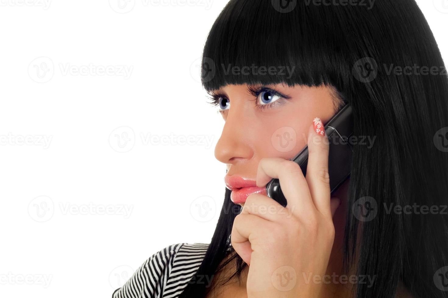 Portrait of the girl speaking on the phone. Isolated photo