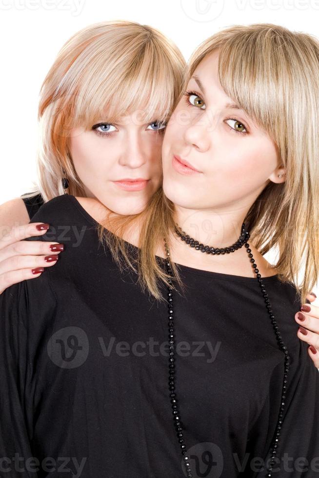 Portrait of  the two young beauty blonde. Isolated photo