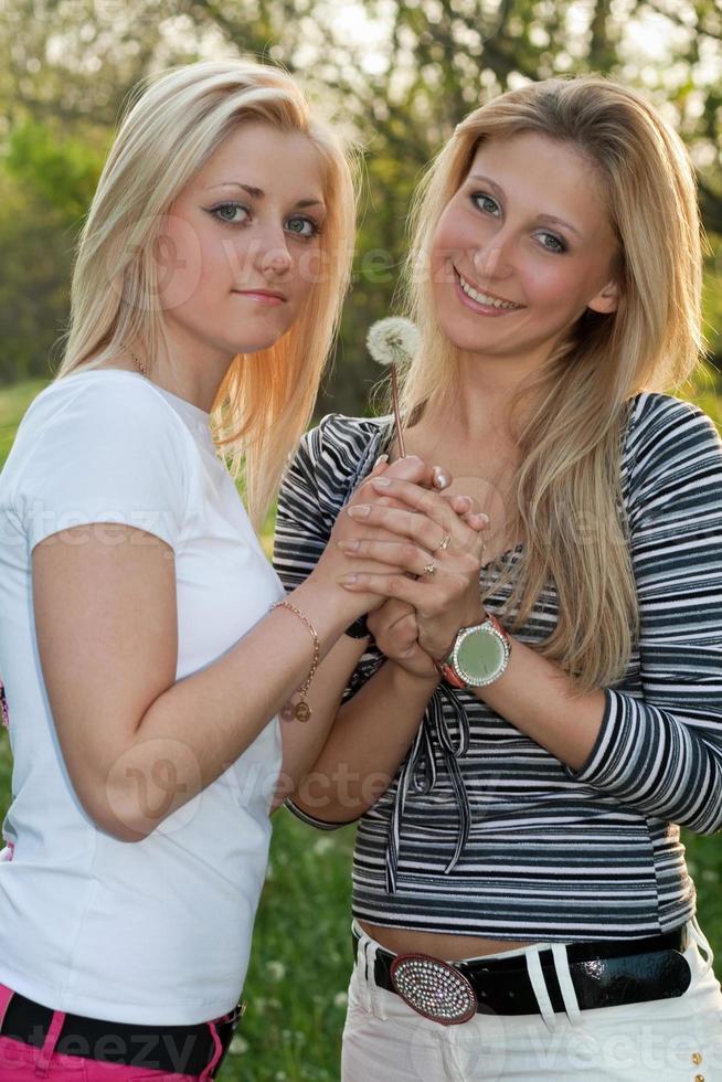 Two smiling young blonde photo