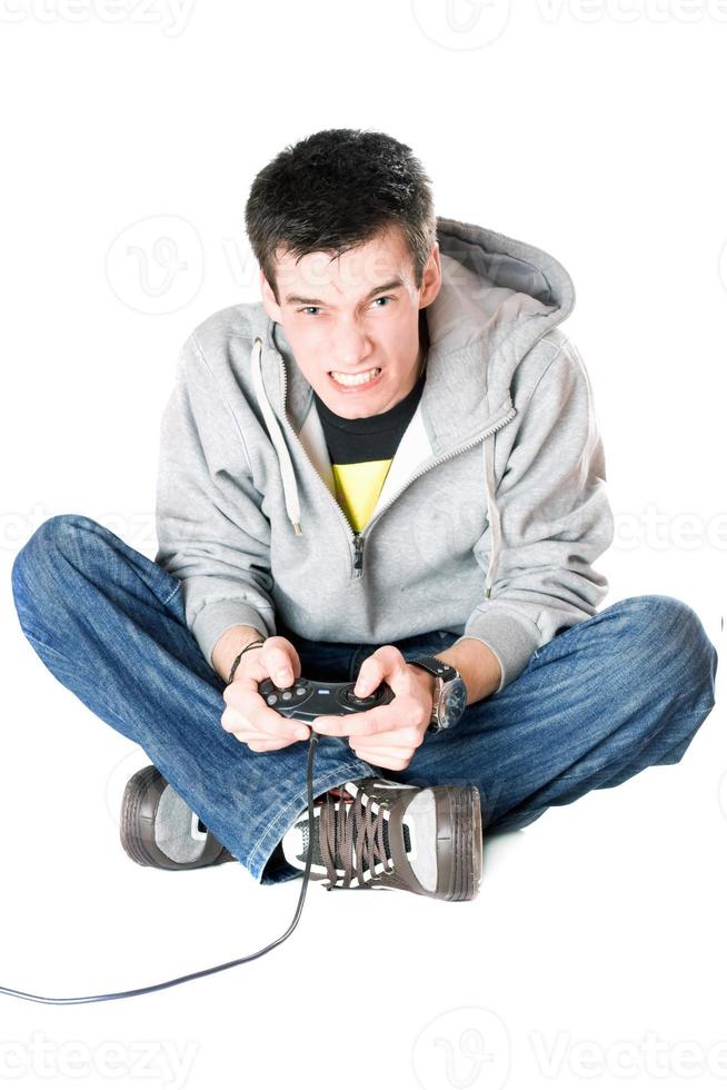 Furious guy with a joystick for game console photo