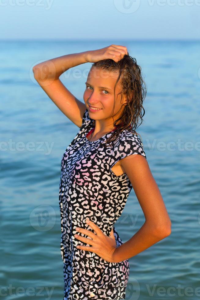 attractive teen girl in wet dress photo