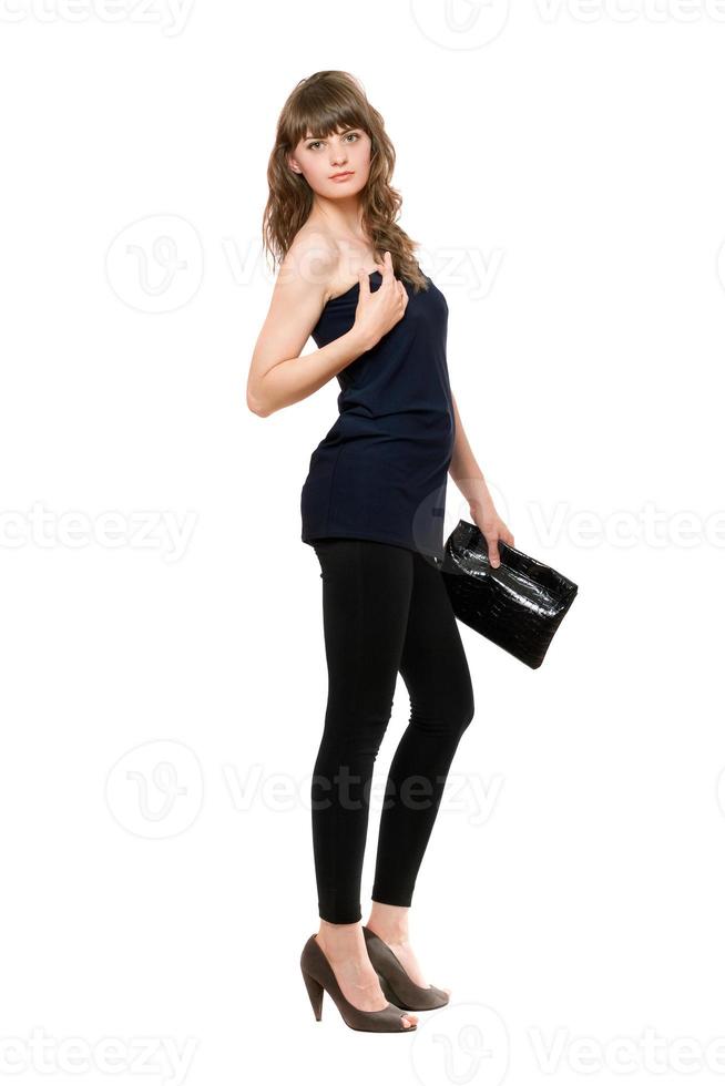 Nice girl in black leggings with a handbag photo