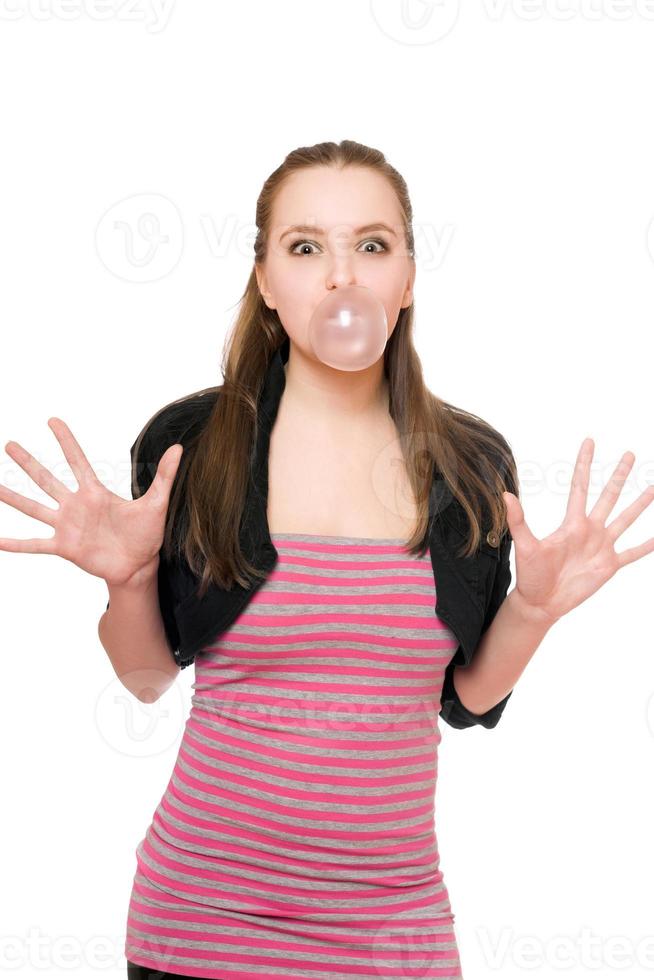 Young woman blowing a bubble photo