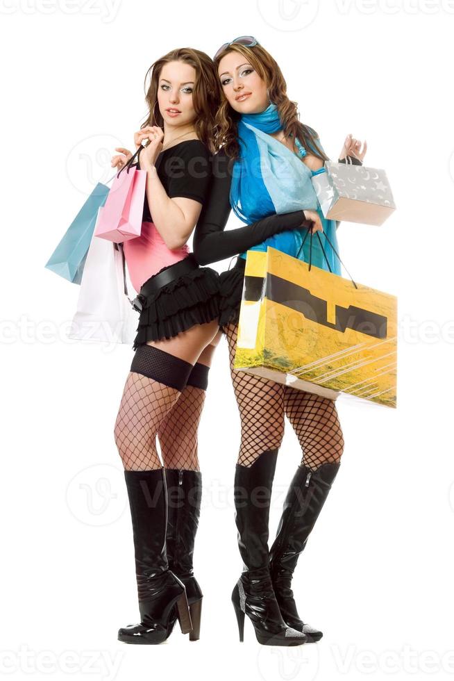 Two attractive young women after shopping photo