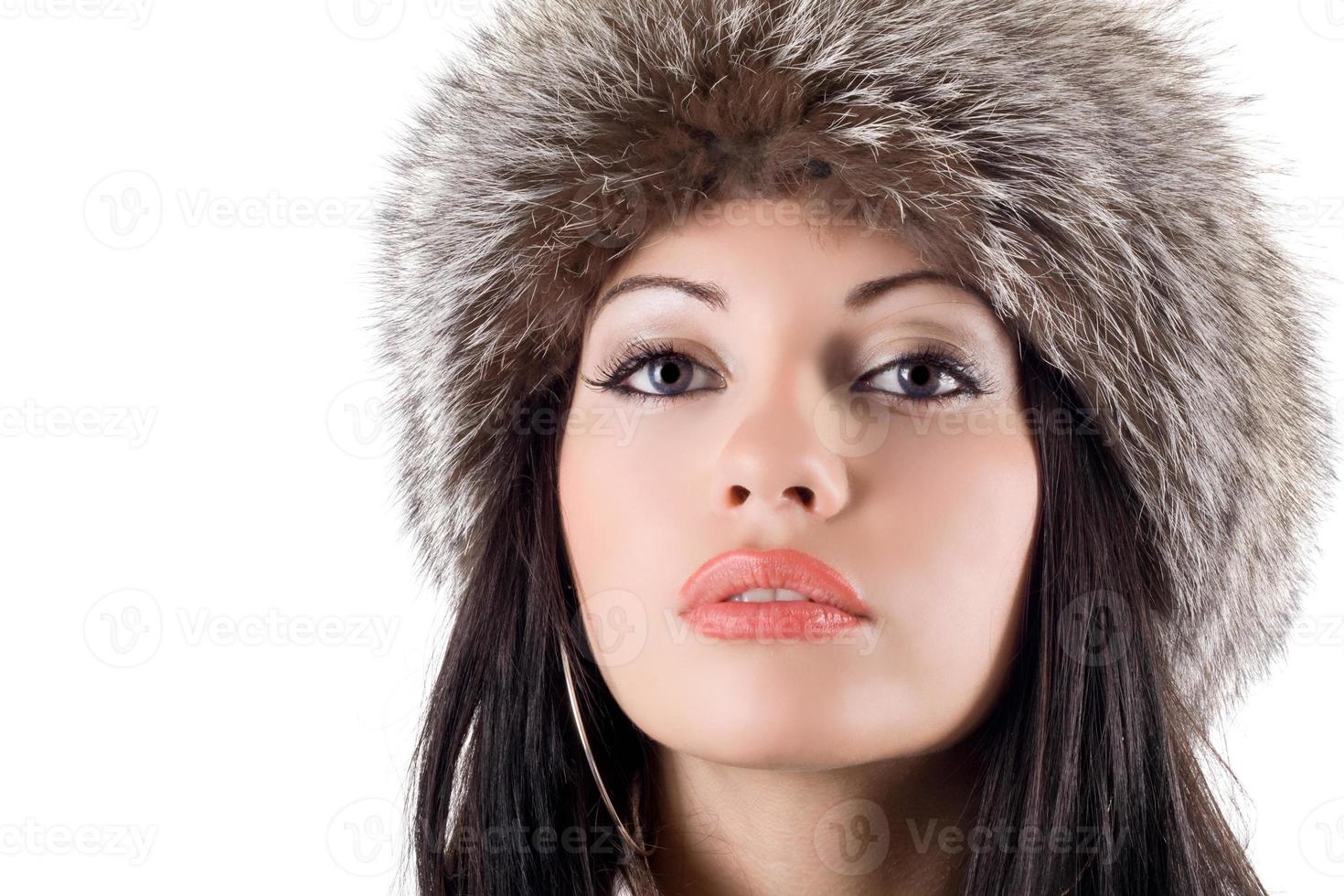 Portrait of the young woman in a fur cap photo