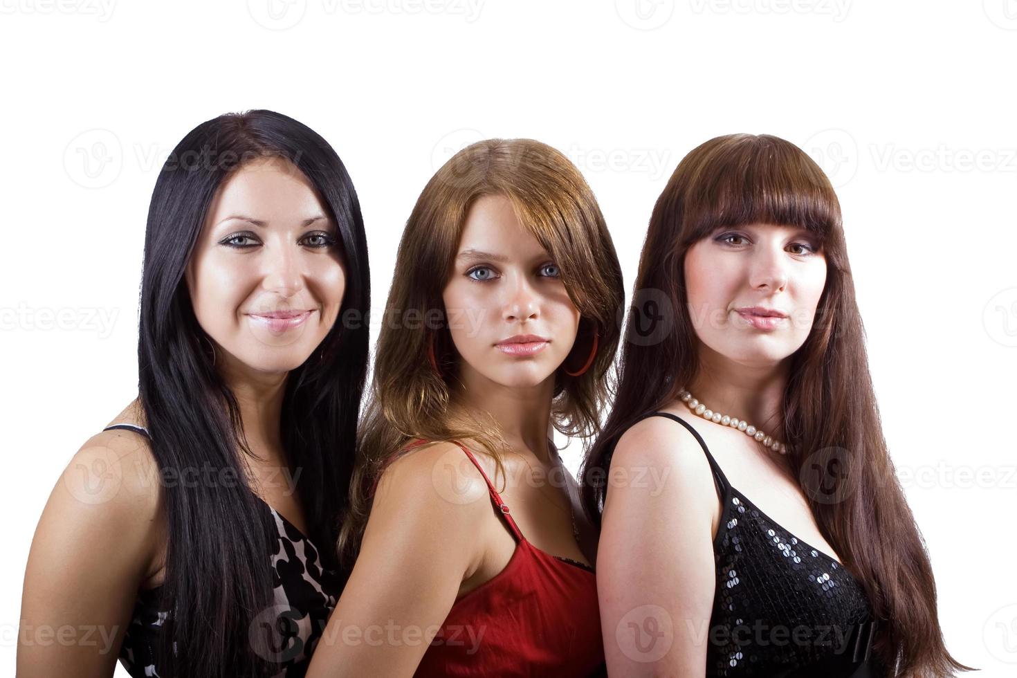 Portrait of three beautiful young women. Isolated 2 photo