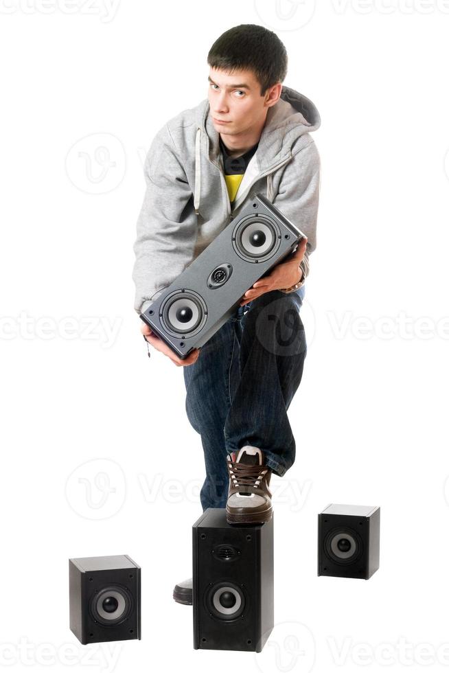 Young man with a speakers. Isolated photo