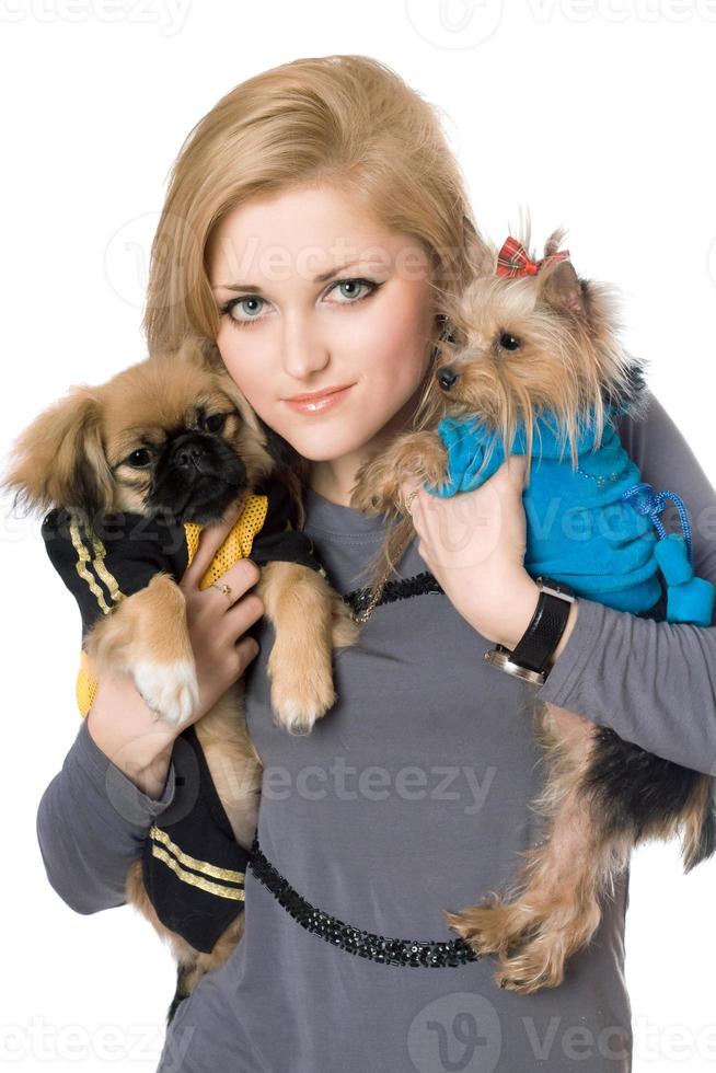 Portrait of pretty blonde with two dogs. Isolated photo