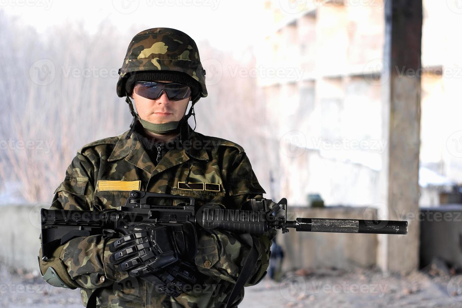 Handsome man with a rifle photo