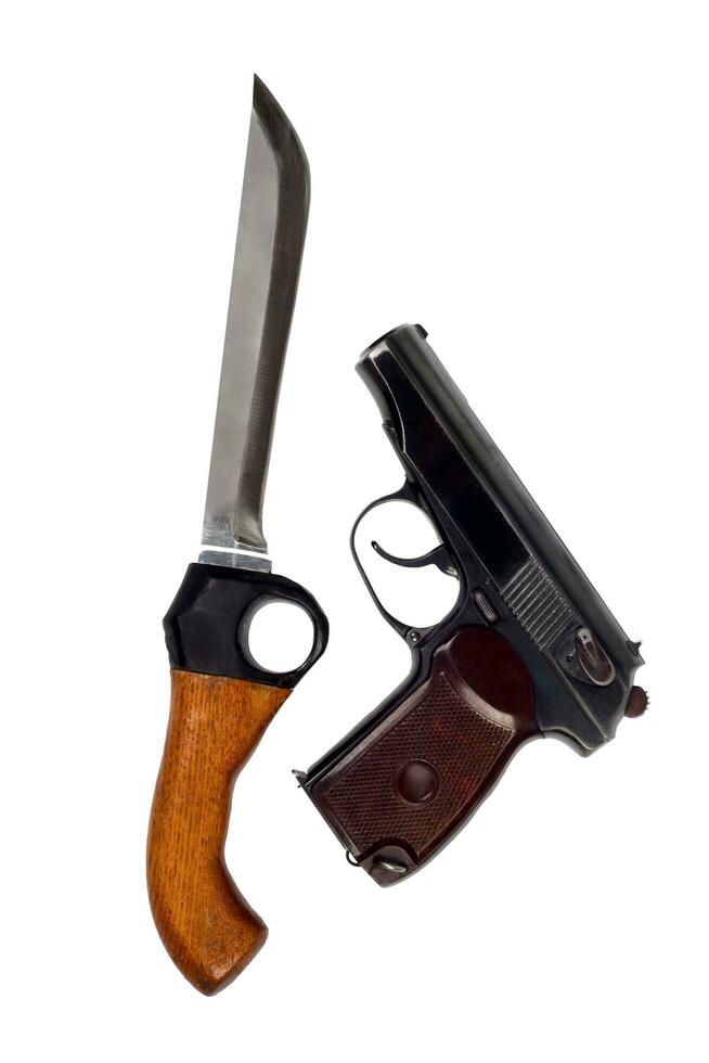 Knife and pistol. Isolated on white background photo