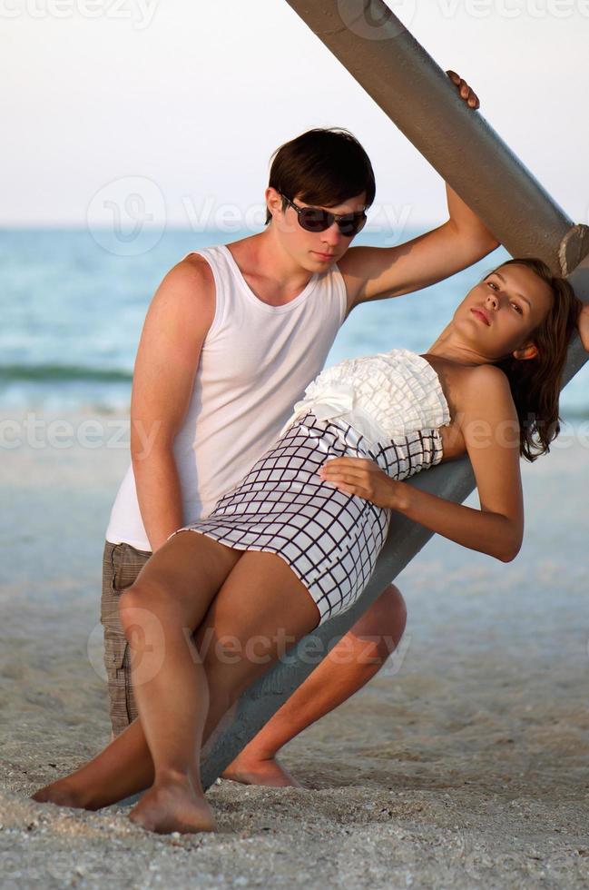 Beautiful young couple on the beach photo