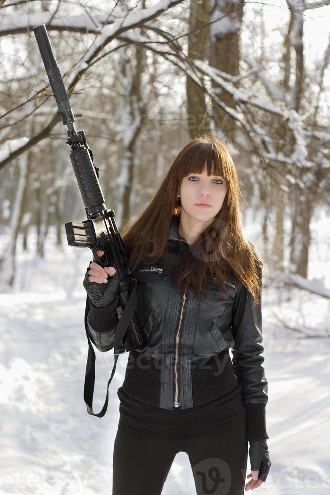 Brunette with the raised rifle photo