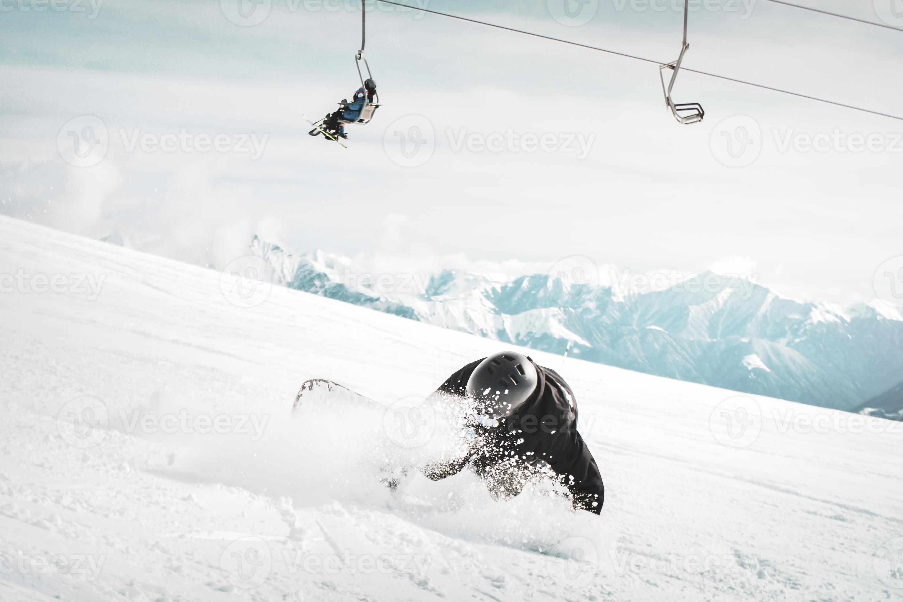 snowboarder is riding with snowboard from powder snow hill very fast and  fall down 18950981 Stock Photo at Vecteezy