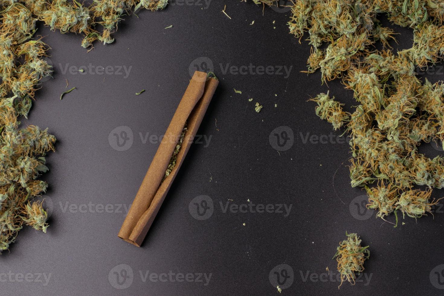 Blunt with cannabis top view on background with copy space. Marijuana medical or recreational use concept photo