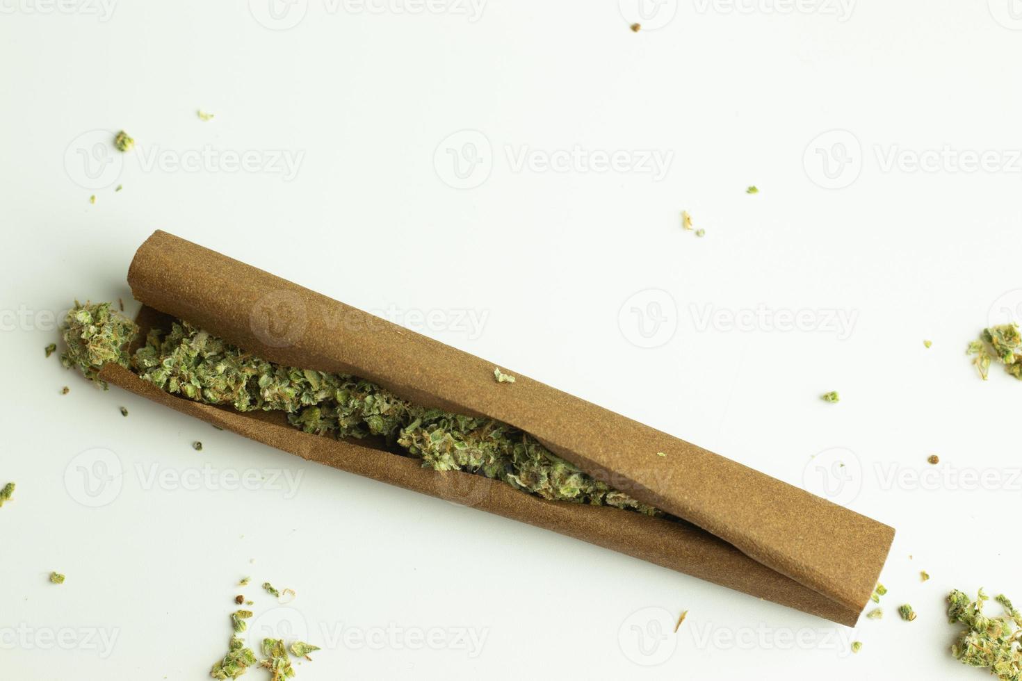 Cannabis blunt roll on white background isolated photo