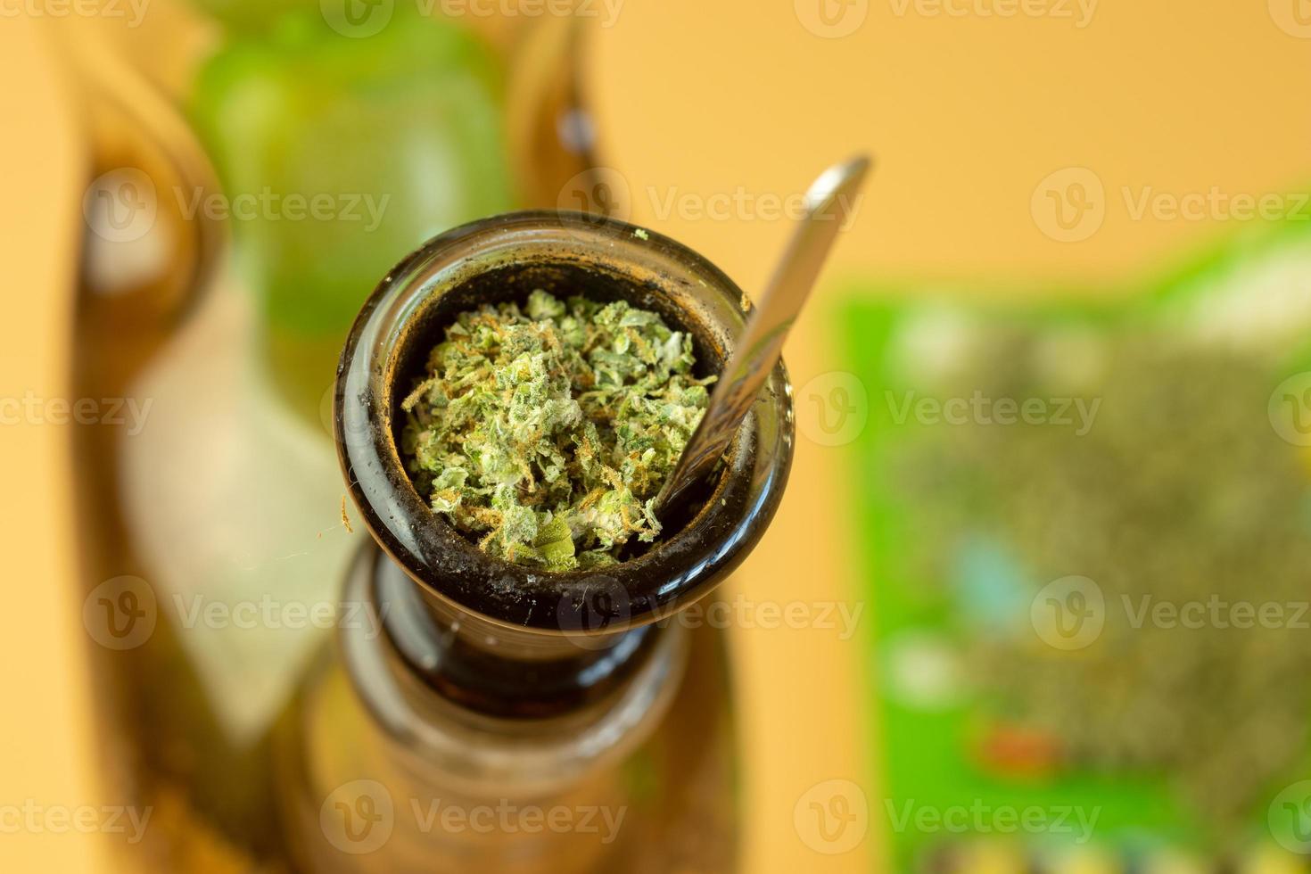 Bong filled with cannabis for recreational use. Marijuana legalize concept photo