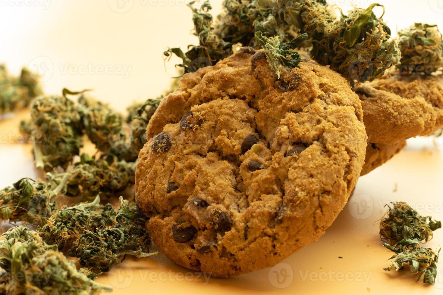 Cannabis product concept, oat cookie and marijuana buds close-up. Legal weed use photo