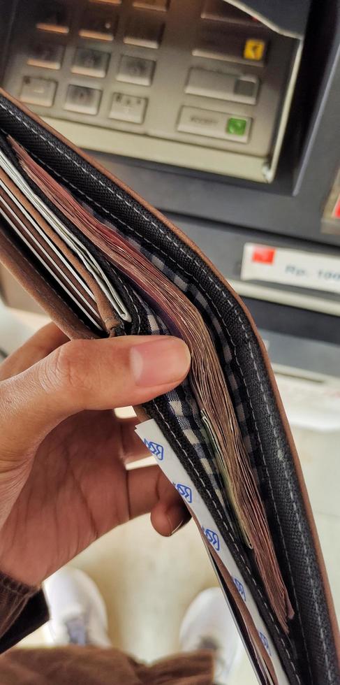Portrait of hundreds of thousands of rupiah bills in the wallet photo
