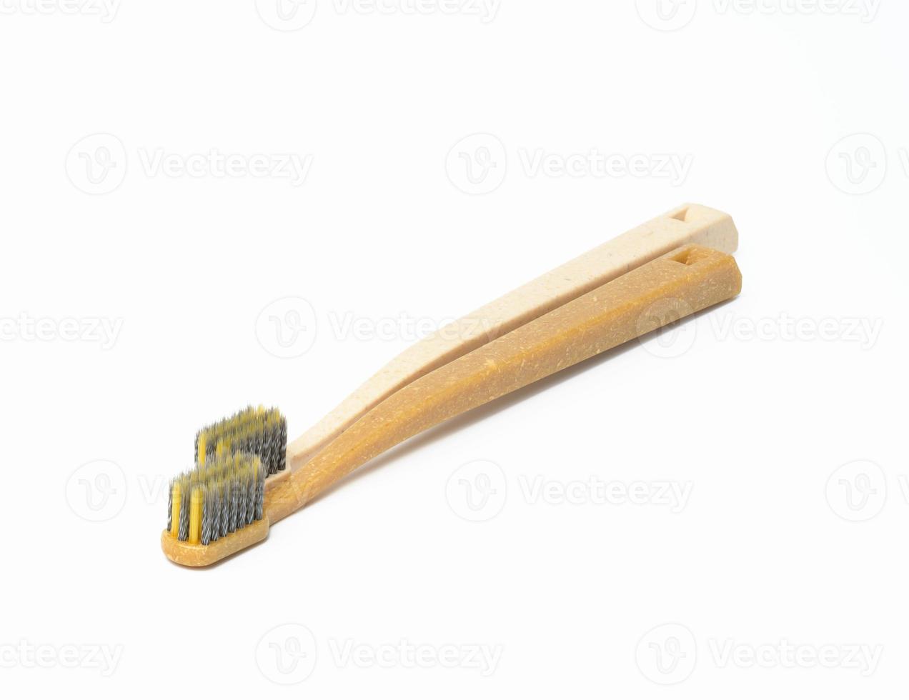 two plastic toothbrushes on a white background photo