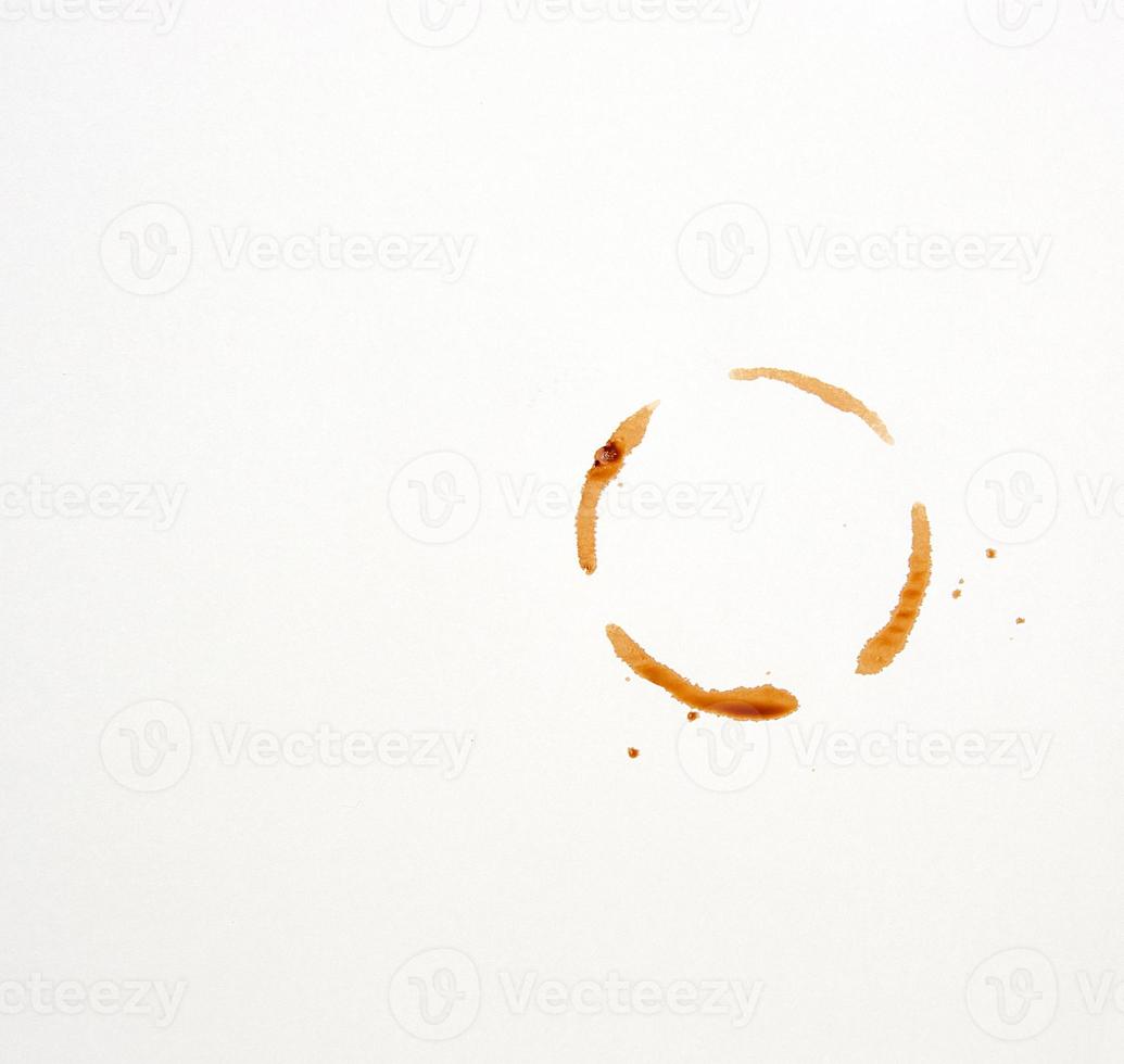 round imprint of a coffee cup on a white paper background photo
