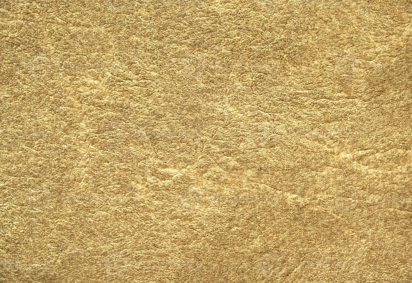 fragment of beige wool carpet, full frame photo