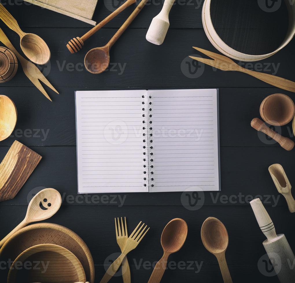 open notebook in a line on a black table photo