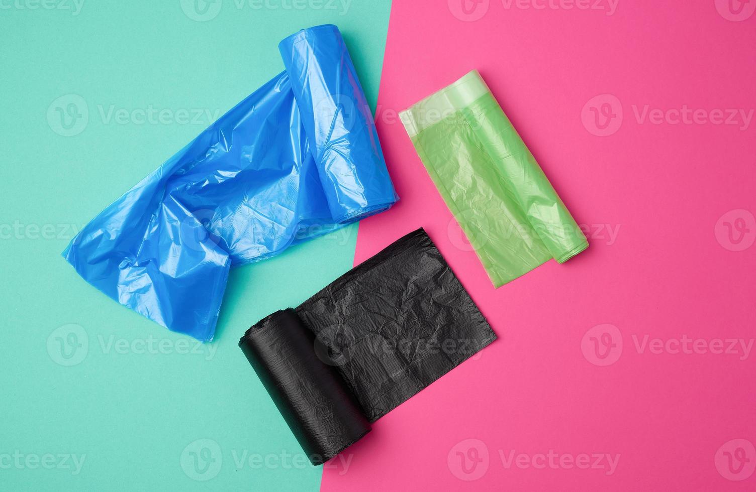 three rolled up rolls with plastic garbage bags photo