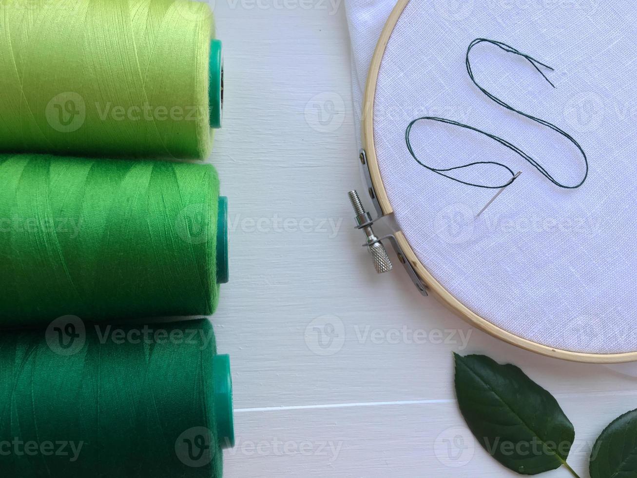Wooden hoop, fabric and thread photo