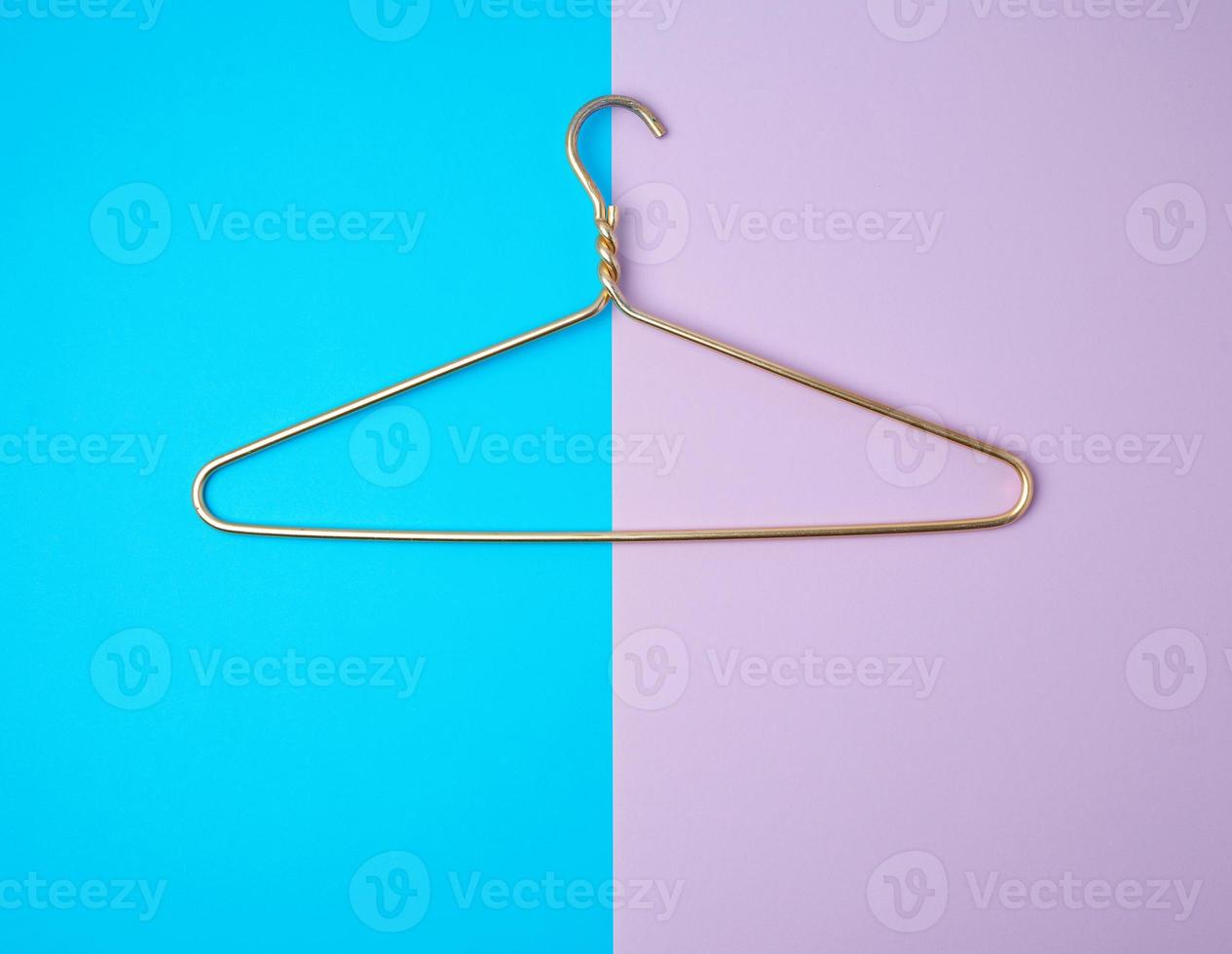 yellow metal hanger on a colored background photo